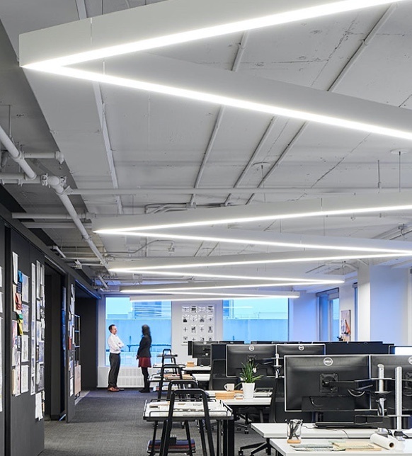 Rectangular lighting fixtures in an open office space 