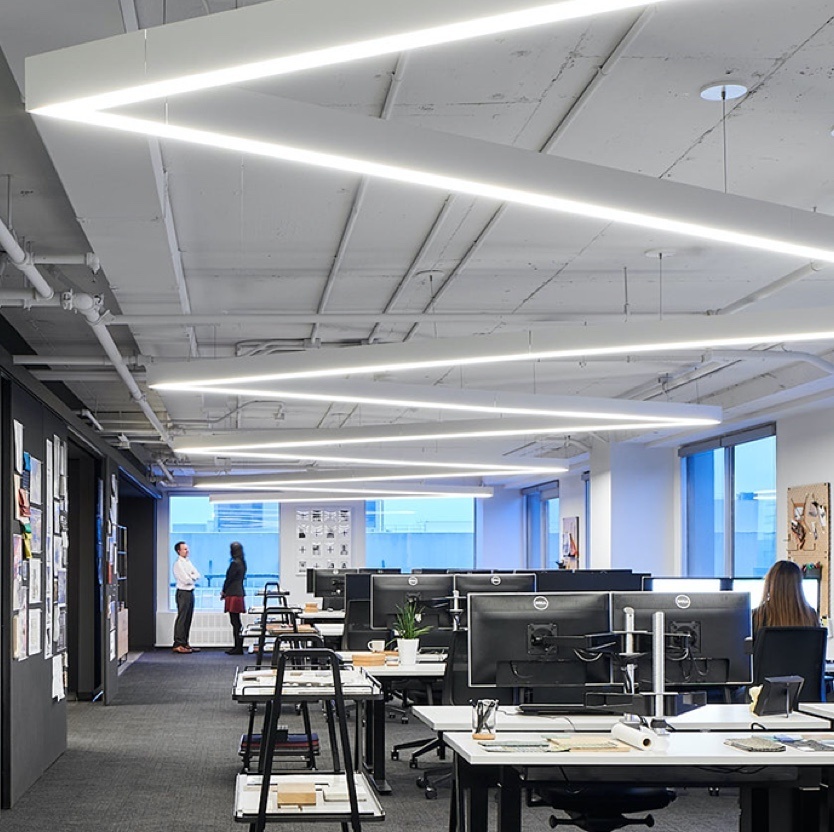 Rectangular lighting fixtures in an open office space 