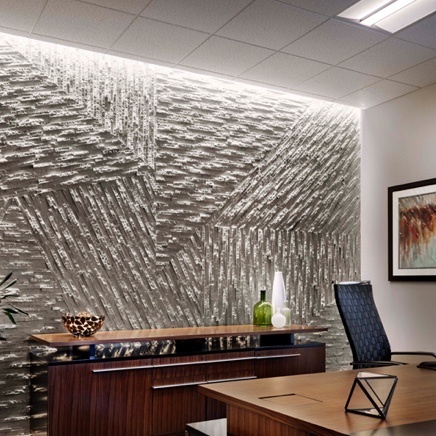 Asymmetric lighting on textured wall in office
