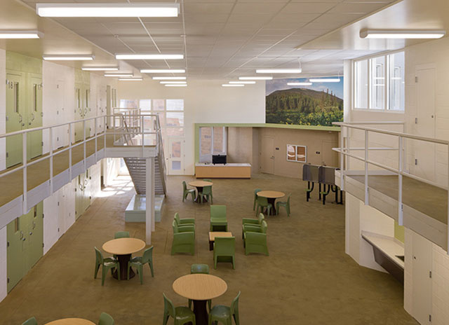 Correctional facility lighting with green chairs