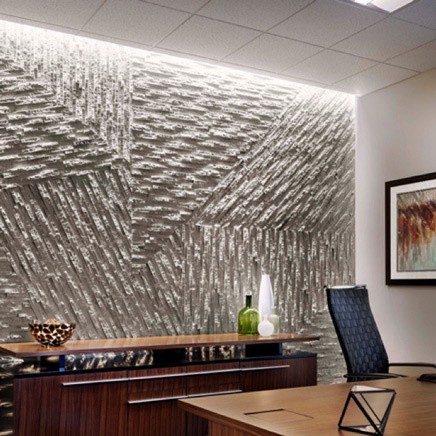 Asymmetric lighting on textured wall in office